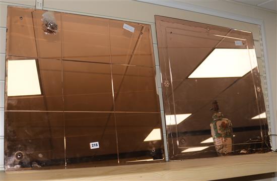 Two peach glass mirrors